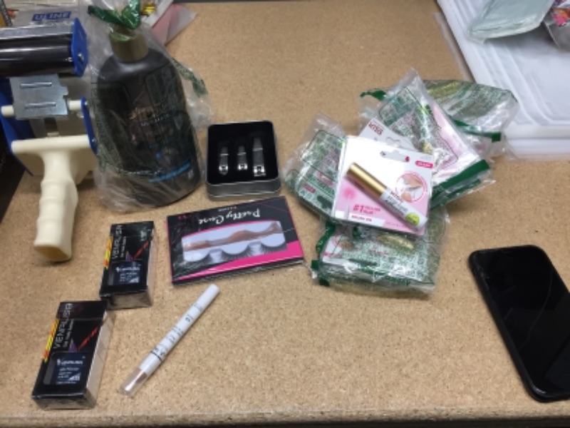 Photo 1 of NON-REFUNDABLE BAG OF ASSORTED MAKEUP
eyelash glue, nail polish, lotion and more 