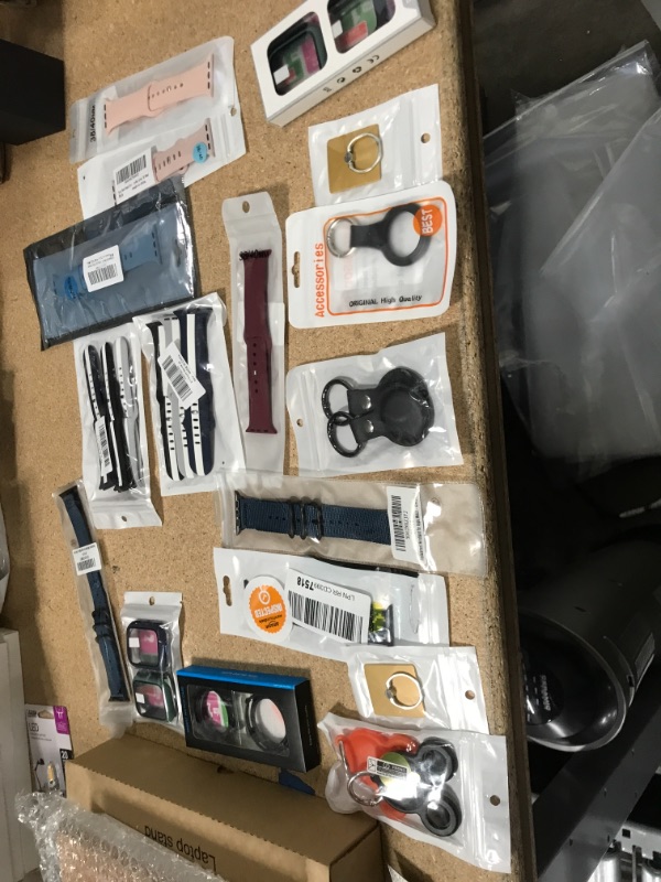 Photo 1 of NON-REFUNDABLE BAG OF ASSORTED PHONE ACCESSORIES*
including; watch band, air tag case, and more 