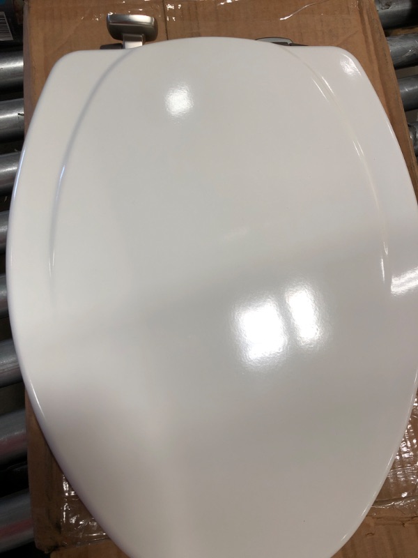 Photo 3 of **DAMAGE TO SEAT** Mayfair Slow Close Elongated White Molded Wood Toilet Seat
