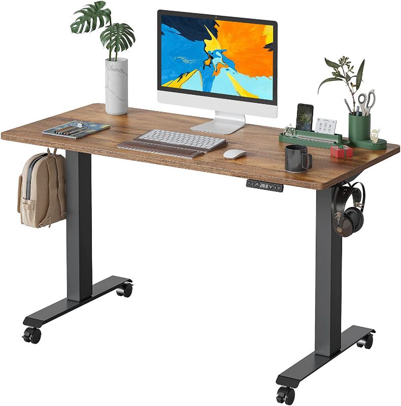 Photo 1 of FAMISKY Standing Desk Dual Motors, Adjustable Height Electric Stand up Desk, 40 x 24 Inches Sit Stand Home Office Desk, Ergonomic Workstation Black Steel Frame/Rustic Brown Wood Tabletop
