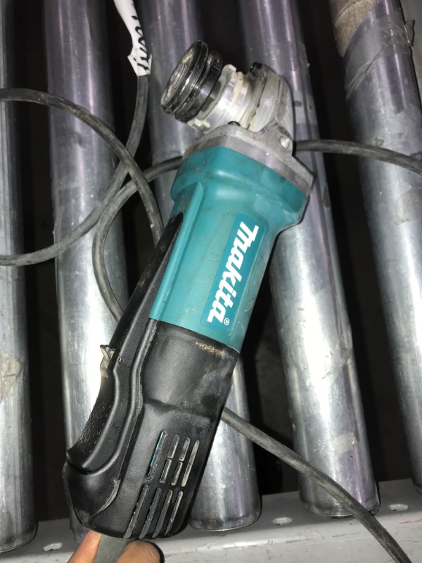 Photo 4 of Makita 9557PB 4-1/2" Paddle Switch Angle Grinder, with AC/DC Switch
