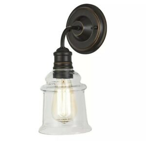 Photo 1 of 1-Light Antique Bronze Wall Sconce with Clear Glass Shade
