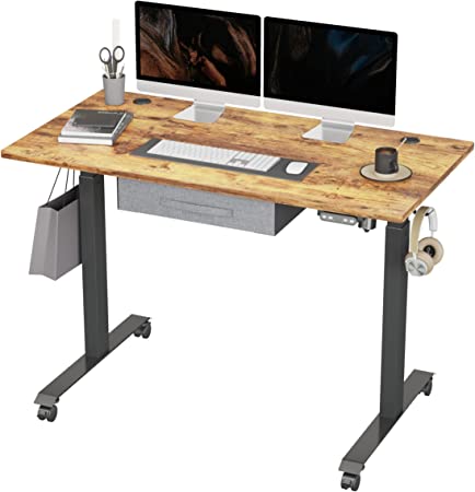 Photo 1 of FEZIBO Standing Desk with Drawer, Adjustable Height Electric Stand up Desk, 48 x 24 Inches Sit Stand Home Office Desk, Ergonomic Workstation Black Steel Frame/Rustic Brown Tabletop