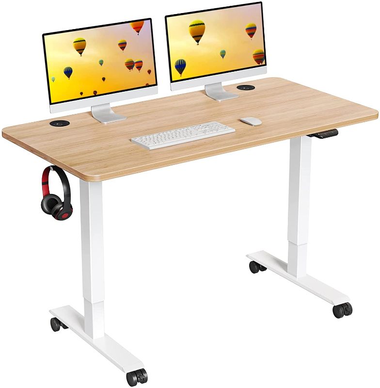 Photo 1 of WOKA Electric Standing Desk, 48 x 24 Inch Height Adjustable Desk, Stand Up Desk with Casters, Sit to Stand Desk with Splice Board, Computer Workstation for Home Office, Oak Top + White Frame
