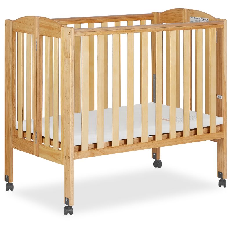 Photo 1 of *Loose hardware, may be incomplete*
Dream on Me 2-in-1 Folding Portable Crib in Natural
