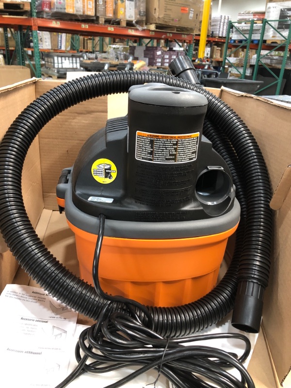 Photo 2 of ***MISSING DUST BAG, LOCKING HOSE AND CAR NOZZLE***RIDGID 4 Gal. 5.0-Peak HP Portable Wet/Dry Shop Vacuum with Filter, Dust Bag, Locking Hose and Car Nozzle, Oranges/Peaches