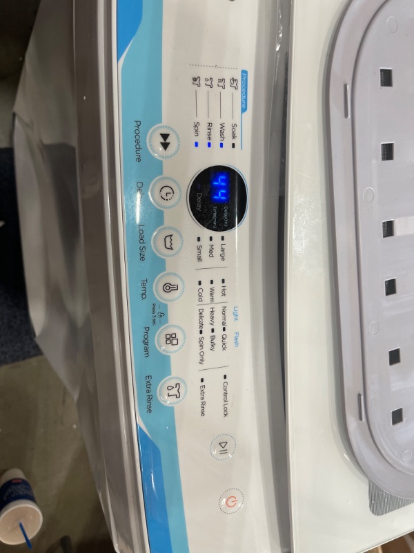 Photo 2 of COMFEE’ Washing Machine 2.0 Cu.ft LED Portable Washing Machine and Washer Lavadora Portátil Compact Laundry, 6 Models, Energy Saving, Child Lock for RV, Dorm, Apartment Ivory White

**major dents, powers on**
