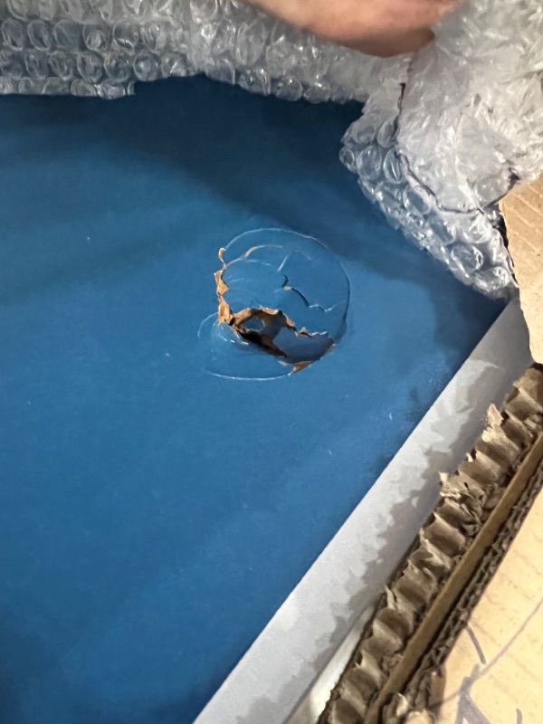 Photo 1 of INCOMPLETE INLUDES ONLY THE TABLE**GoSports 6’x3’ Mid-Size Table Tennis Game Set - Indoor/Outdoor Portable Table Tennis Game with Net, 2 Table Tennis Paddles and 4 Balls, Blue 
IT IS DAMAGEDE HAS A WHOLE ON TABLE SEE PICTURES
