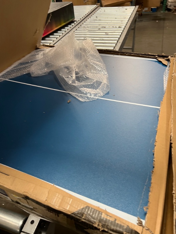 Photo 1 of INCOMPLETE INLUDES ONLY THE TABLE**GoSports 6’x3’ Mid-Size Table Tennis Game Set - Indoor/Outdoor Portable Table Tennis Game with Net, 2 Table Tennis Paddles and 4 Balls, Blue 
IT IS DAMAGEDE HAS A WHOLE ON TABLE SEE PICTURES
