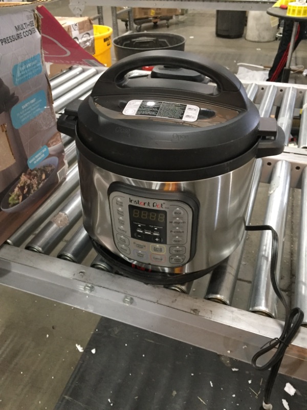 Photo 2 of *SEE last pictures for damage*
Instant Pot Duo 7-in-1 Electric Pressure Cooker, 8 Quart, Stainless Steel/Black
