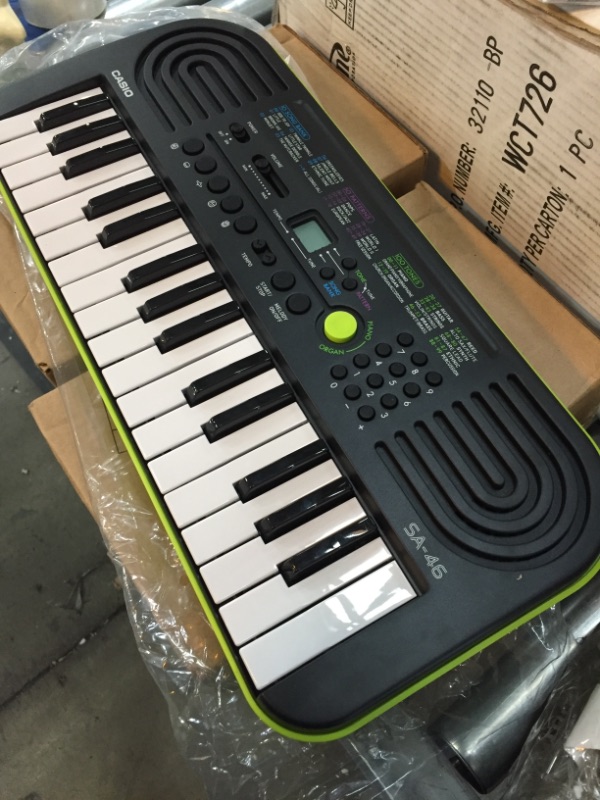 Photo 2 of *MISSING power cord* 
*batteries NOT included* 
Casio SA46 Portable Keyboard with World Tour Power Supply
