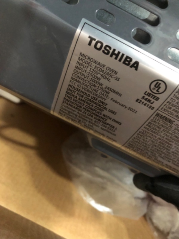 Photo 6 of *SEE last picture for damage*
Toshiba EC042A5C-SS Countertop Microwave Oven with Convection, Smart Sensor, Sound On/Off Function and LCD Display, 1.5 Cu.ft, Stainless Steel
