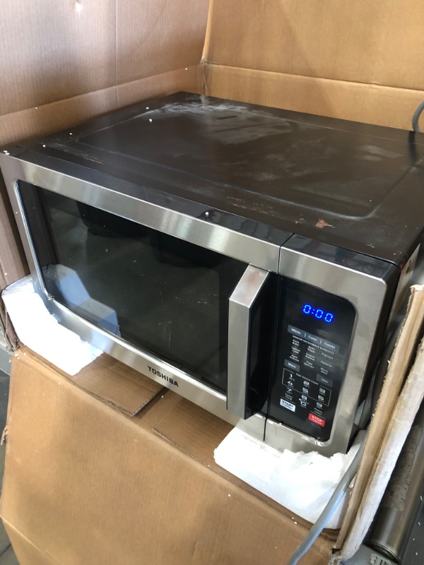 Photo 2 of *SEE last picture for damage*
Toshiba EC042A5C-SS Countertop Microwave Oven with Convection, Smart Sensor, Sound On/Off Function and LCD Display, 1.5 Cu.ft, Stainless Steel
