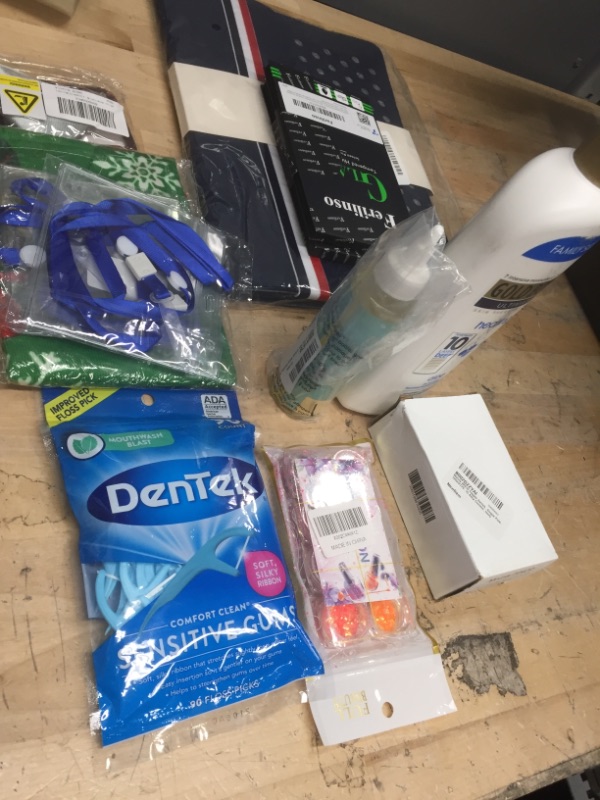 Photo 1 of **NOT REFUNDABLE** BUNDLE OF ASSORTED ITEMS ( FLOSS, LOTION, GLASS SCREEN PROTECTORS ETC...)
