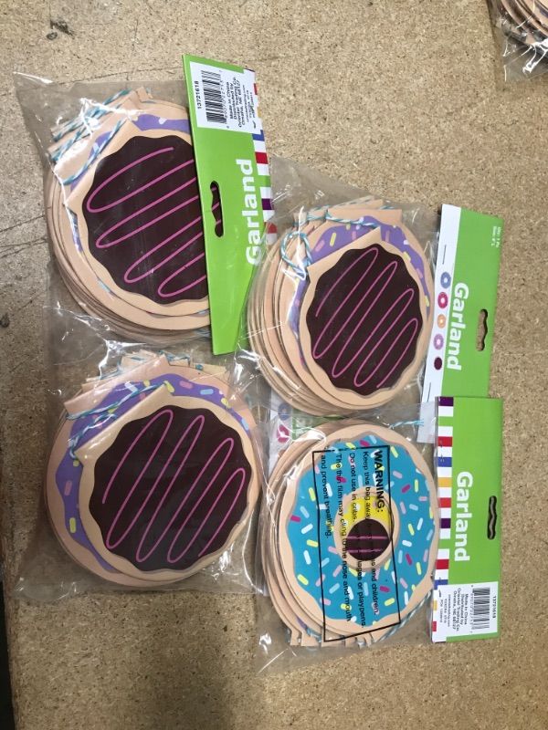 Photo 1 of **SET OF 4**
Fun Express - Donut Party Garland for Birthday - Party Decor - Hanging Decor - Garland - Birthday