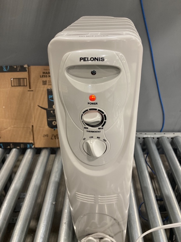 Photo 1 of PELONIS PHO15A2AGW, Basic Electric Oil Filled Radiator, 1500W Portable Full Room Radiant Space Heater with Adjustable Thermostat, White, 26.10 x 14.20 x 11.00 in

