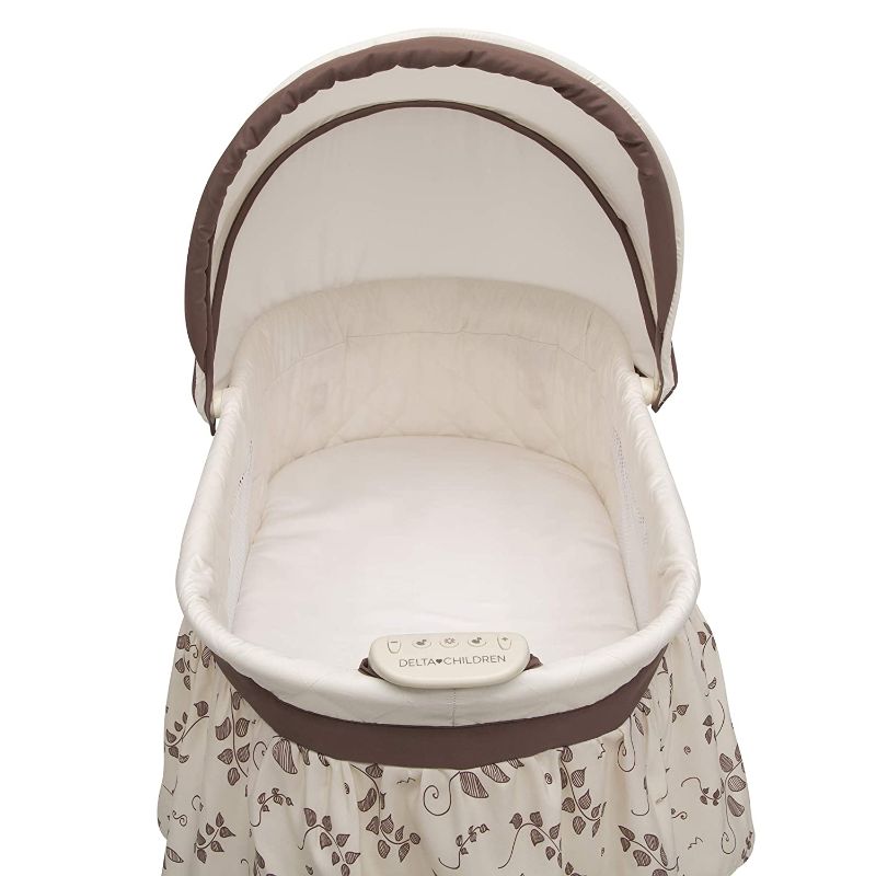 Photo 1 of Delta Children Deluxe Sweet Beginnings Bedside Bassinet - Portable Crib with Lights and Sounds, Falling Leaves
