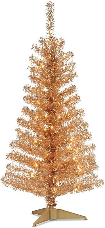 Photo 1 of (only some of the lights work )
National Tree Company Pre-Lit Artificial Christmas Tree, Champagne Gold Tinsel, White Lights, Includes Stand, 4 feet