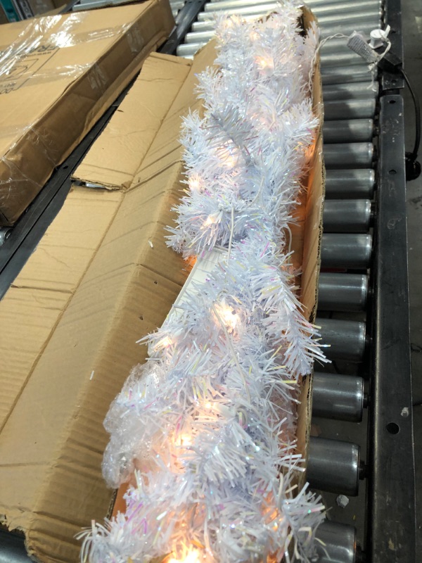 Photo 3 of *Tested and functioned*
National Tree 4 Foot Pink Tinsel Tree with Plastic Stand and 70 Clear Lights (TT33-306-40)