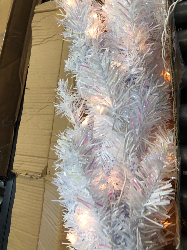 Photo 2 of *Tested and functioned*
National Tree 4 Foot Pink Tinsel Tree with Plastic Stand and 70 Clear Lights (TT33-306-40)