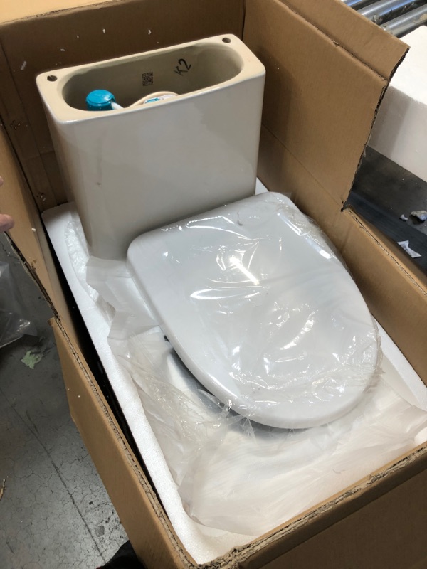 Photo 2 of **HARDWARE LOOSE IN BOX*** Swiss Madison Sublime II Compact Dual-Flush Toilet with Side Holes (Seat Included)
