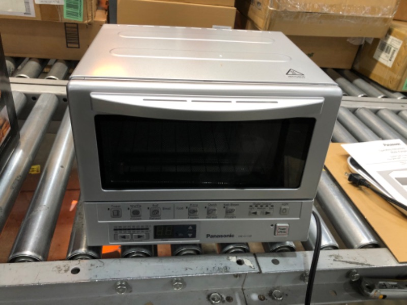 Photo 2 of **NOT FUNCATIONAL**
Panasonic Toaster Oven FlashXpress with Double Infrared Heating and Removable 9-Inch Inner Baking Tray, 12 x 13 x 10.25, Silver
