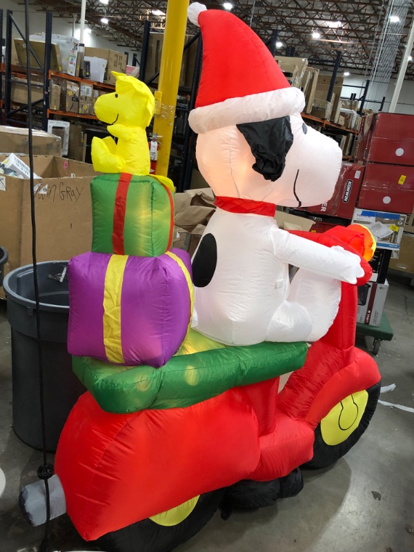 Photo 2 of **SLIGHTLY DIFFERENT FROM STOCK PHOTO**
6 ft Pre-Lit LED Airblown Peanuts Snoopy with Woodstock on Moped Scene Christmas Inflatable
