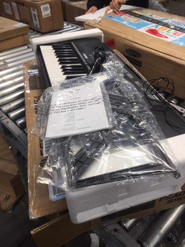 Photo 2 of Alesis Melody 54 - Electric Keyboard Digital Piano with 54 Keys, Speakers, 300 Sounds, 300 Rhythms, 40 Songs, Microphone and Piano Lessons
