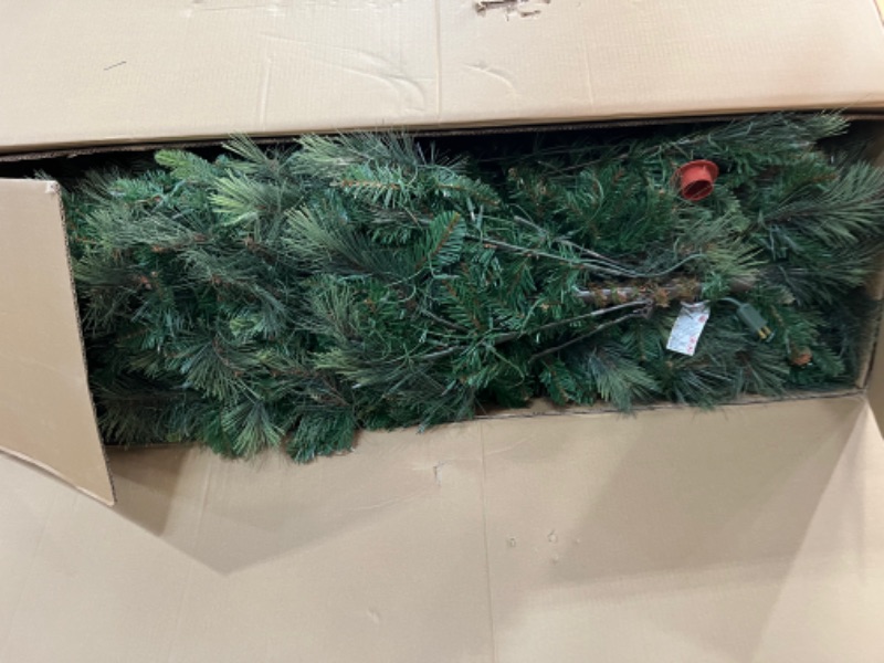 Photo 2 of 
National Tree Company Pre-lit Artificial Christmas Tree | Includes Pre-strung White Lights and Stand | Flocked with Cones | Carolina Pine - 9 ft
****LIGHTS ARE NOT FUNCTIONAL****
