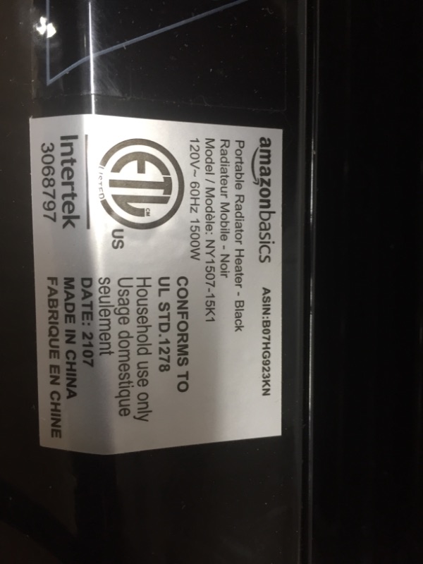 Photo 1 of Amazon Basics Indoor Portable Radiator Heater - Black
