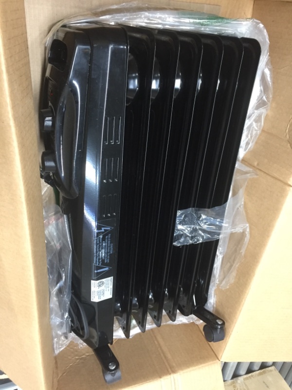 Photo 1 of Amazon Basics Indoor Portable Radiator Heater - Black
