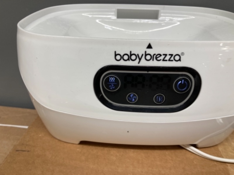 Photo 3 of Baby Brezza Sterilizer & Dryer Advanced, Effective Steam Sterilization, HEPA Filter, Dries 33% Faster, Highest Capacity, Holds 8 Bottles & 2 Pump Part Sets from Any Brand, Universal Fit, White
