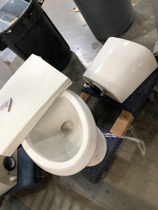 Photo 2 of 2-piece 1.1 GPF/1.6 GPF High Efficiency Dual Flush Complete Elongated Toilet in White, Seat Included