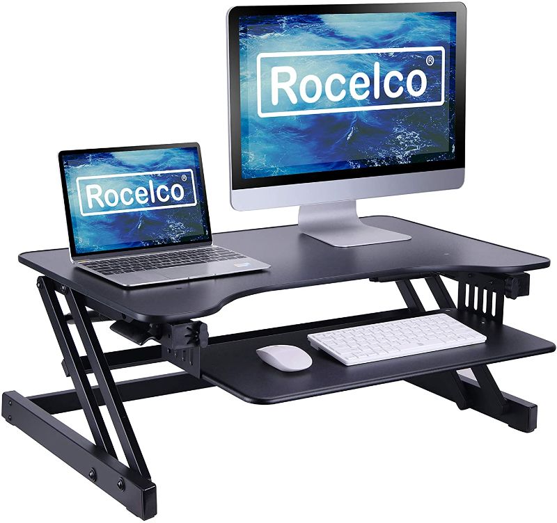 Photo 1 of Rocelco 32" Height Adjustable Standing Desk Converter - Quick Sit Stand Up Dual Monitor Riser - Gas Spring Assist Tabletop Computer Workstation - Large Retractable Keyboard Tray - Black (R ADRB)
