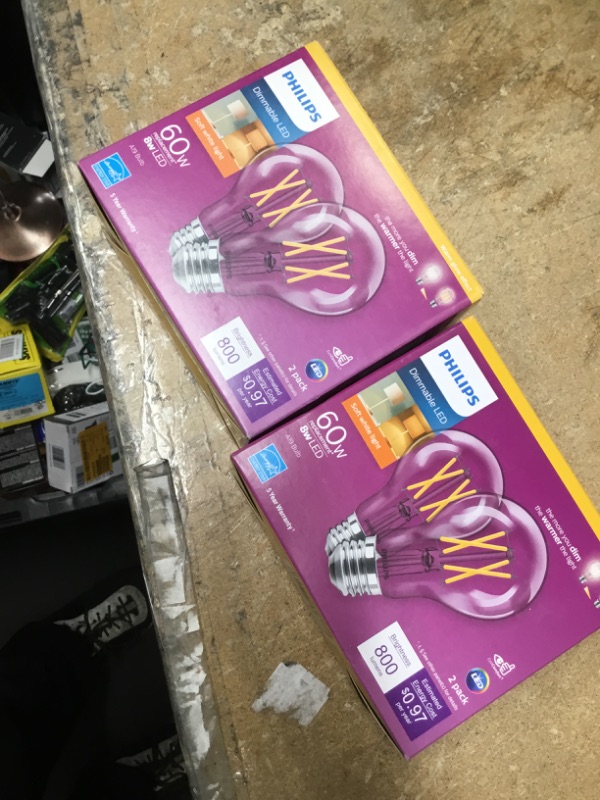 Photo 2 of 
Philips
60-Watt Equivalent A19 Dimmable with Warm Glow Dimming Effect Clear Glass LED Light Bulb Soft White (2700K) (4-Pack)