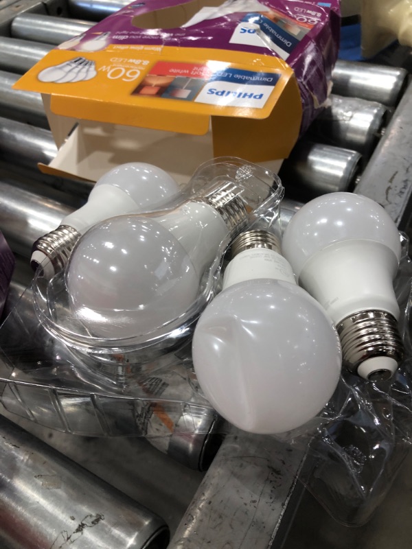Photo 2 of ***SMALL DENT IN BULB *** Philips LED Dimmable Warm Glow Effect A19, Flicker-Free, EyeComort Technology, 800 Lumen, 2200K-2700K, 8.8W=60W, E26 Base, Title 20 Certified, 4-Pack
