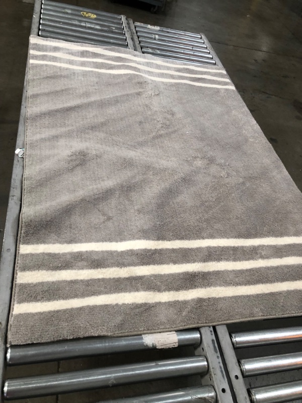 Photo 1 of (FADED COLORS)4'x5'6" Border Striped Rug - Pillowfort™
