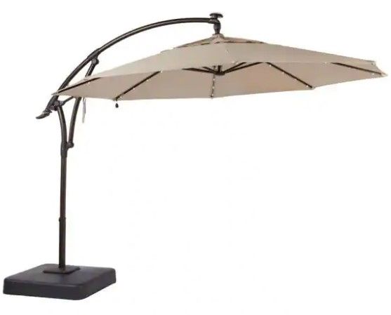 Photo 1 of 11 ft. LED Round Offset Outdoor Patio Umbrella in Sunbrella Sand
