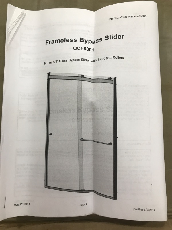 Photo 3 of (BENT METAL ENDS; DAMAGED GLASS CORNER) 
Frameless Bypass Slider (2 glass: 69" X 30.5" per glass)
QCI-5329
3/8” or 1/4” Glass Bypass Slider with Exposed Rollers