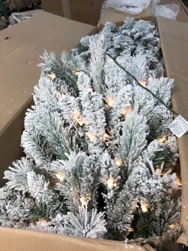 Photo 3 of **INCOMPLETE**
\Puleo International 9 Foot Pre-Lit Flocked Portland Pine Pencil Artificial Christmas Tree with 450 UL Listed Clear Lights
