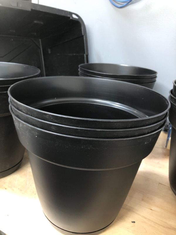 Photo 2 of **SET OF 3**
Graff 11.91 in. x 10.7 in. Black Resin Planter with Saucer