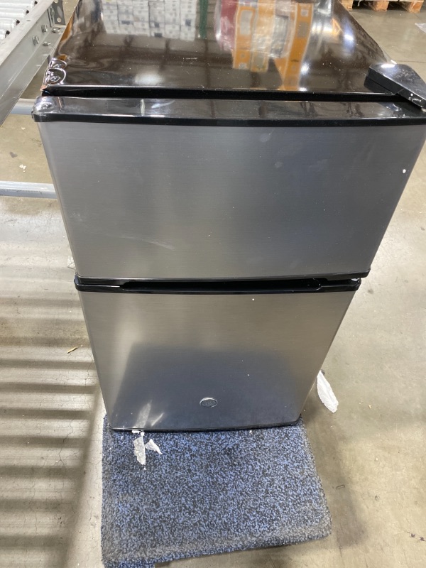 Photo 2 of *Minor Damage* GE 3.1 Cu. Ft Double-Door Compact Refrigerator, Clean Steel