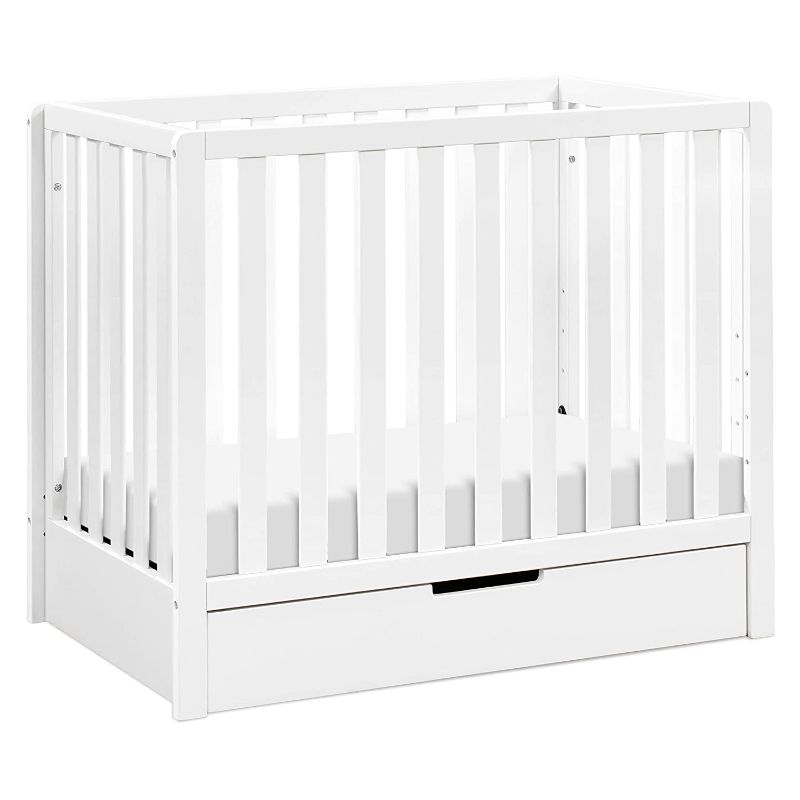 Photo 1 of Carter's by DaVinci Colby 4-in-1 Convertible Mini Crib with Trundle Drawer in White, Greenguard Gold Certified, Undercrib Storage
