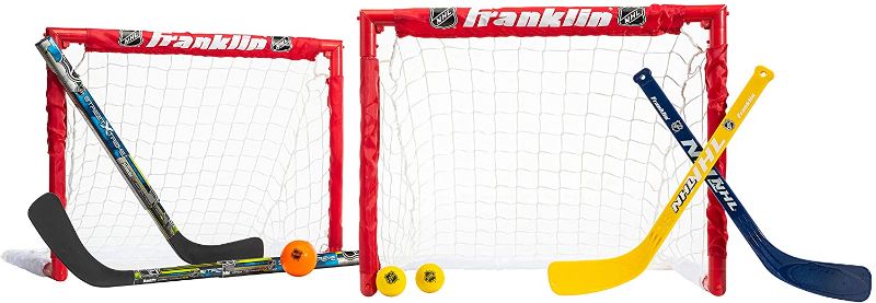Photo 1 of Franklin Sports NHL Kids Mini Hockey Goal Set - (2) Mini + Knee Hockey Goals, (4) Youth Sticks, (2) Goalie Sticks + (4) Foam Balls - Knee + Mini Hockey Set
