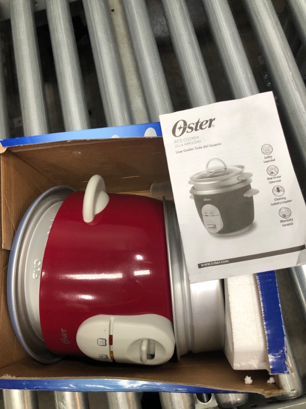 Photo 1 of Oster 6-Cup Rice Cooker with Steamer, Red (004722-000-000)
