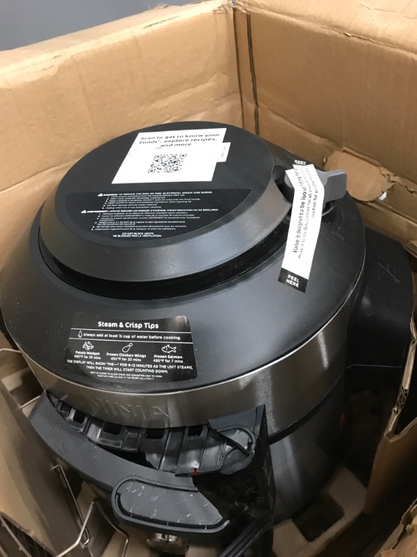 Photo 1 of Ninja OL701 Foodi 14-in-1 SMART XL 8 Qt. Pressure Cooker Steam Fryer with SmartLid & Thermometer + Auto-Steam Release, that Air Fries, Proofs & More, 3-Layer Capacity, 5 Qt. Crisp Basket, Silver/Black
