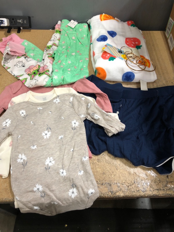 Photo 1 of Assorted goods bundle- baby clothes, XL womens pajama shorts, beach towel, hoop earrings- 6 items 