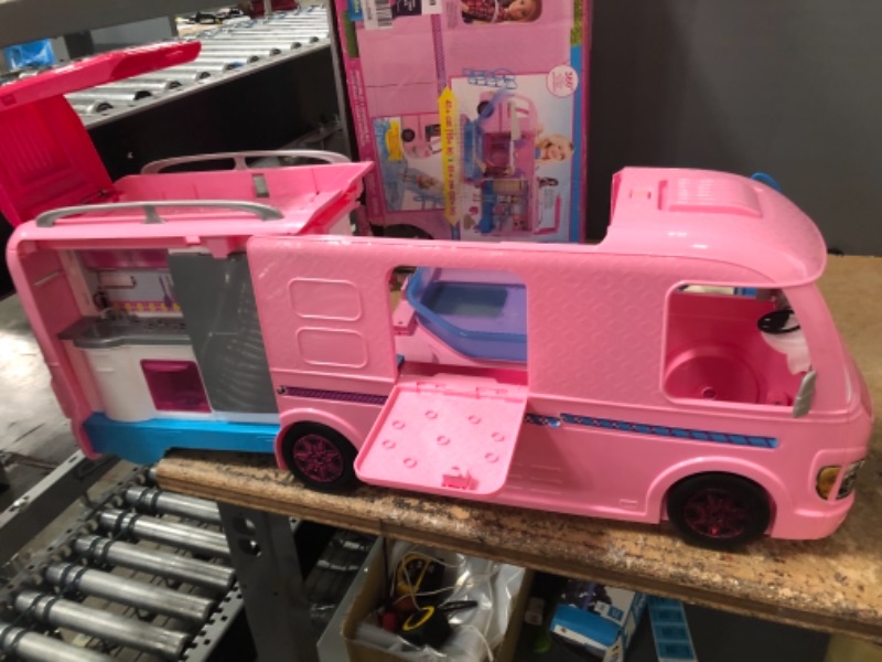 Photo 3 of Barbie Camper Playset With Barbie Accessories, Pool And Furniture, Rolling Vehicle With Campsite Transformation??? (USED. DOLLS AND ACCESSORIES MISSING)
