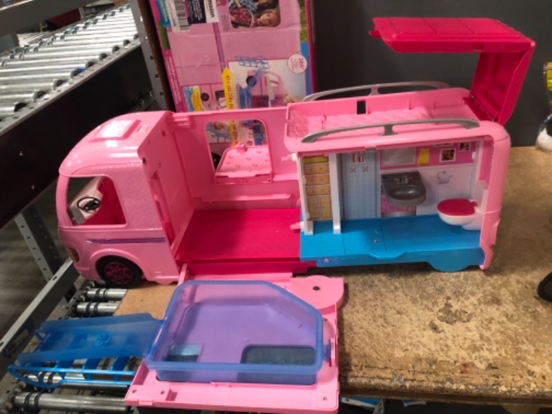 Photo 4 of Barbie Camper Playset With Barbie Accessories, Pool And Furniture, Rolling Vehicle With Campsite Transformation??? (USED. DOLLS AND ACCESSORIES MISSING)
