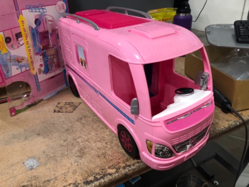 Photo 2 of Barbie Camper Playset With Barbie Accessories, Pool And Furniture, Rolling Vehicle With Campsite Transformation??? (USED. DOLLS AND ACCESSORIES MISSING)
